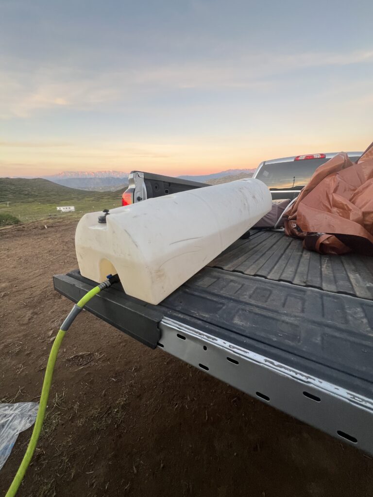 water tank in the bed of a truck