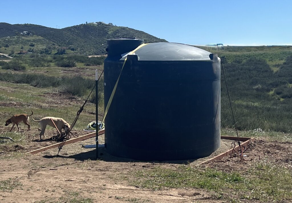 Poly tank strapped to the ground